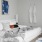 a bed with white sheets and pillows