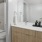a bathroom with a large mirror and shower