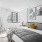 a bedroom with a bed and art on the wall