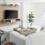 a living room with a tv a chair and a couch